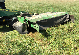 Mowing the fields of Hay